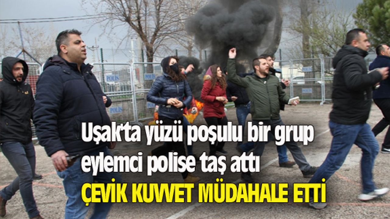 Uşak'ta yüzü poşulu bir grup eylemci polise taş attı